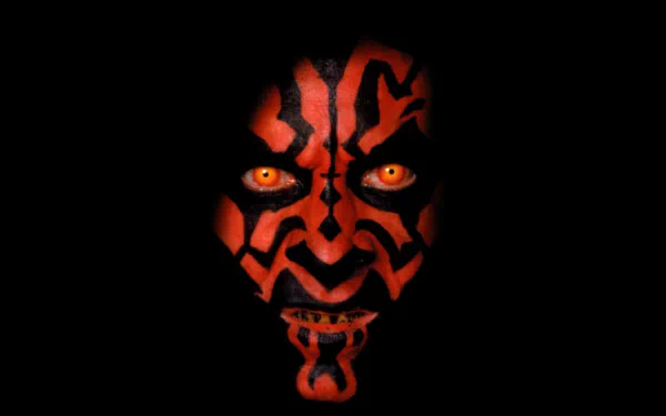 Darth Maul, the menacing Sith from Star Wars: Episode I - The Phantom Menace, is depicted with striking red and black face paint, showcasing his fierce gaze against a dark background.