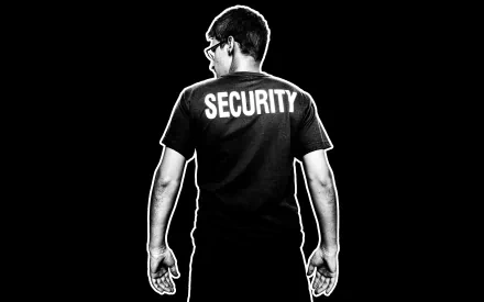 HD desktop wallpaper featuring a silhouette of a man with SECURITY on his t-shirt, set against a black background.