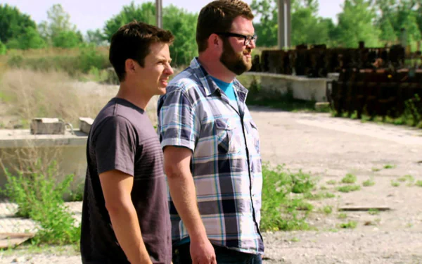 HD desktop wallpaper from Top Gear featuring two presenters standing outdoors with a gritty backdrop.