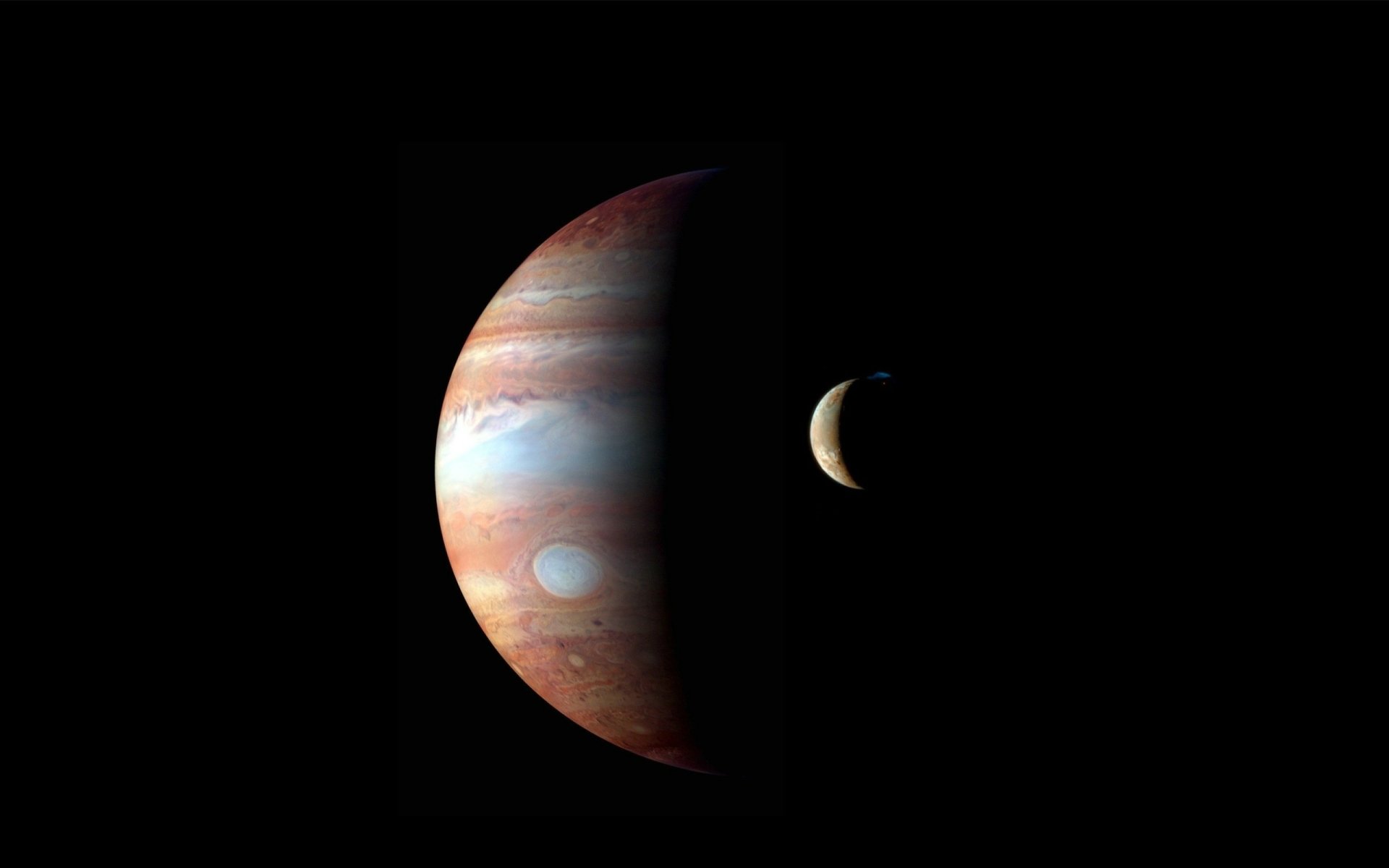 HD sci-fi desktop wallpaper featuring a detailed view of Jupiter and its moon against a black space background.