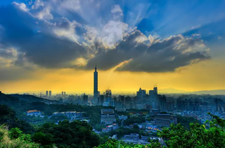 HD desktop wallpaper showcasing Taipei 101 towering over Taipei, China, with a dramatic sunset sky and lush greenery in the foreground.