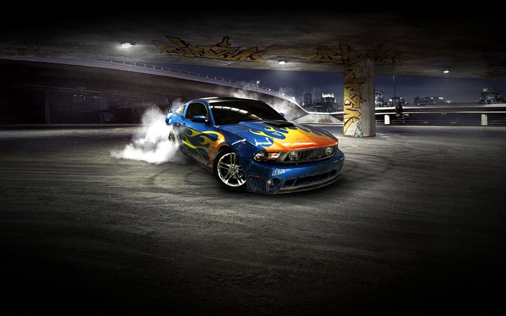 Blue Ford Mustang Shelby with flame livery drifting in a dim parking garage, tires smoking — HD PC desktop wallpaper background.