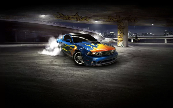 Blue Ford Mustang Shelby with flame livery drifting in a dim parking garage, tires smoking — HD PC desktop wallpaper background.