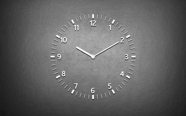 A grey artistic clock with minimalist numbers displays the time against a textured background, serving as an HD PC desktop wallpaper and background.