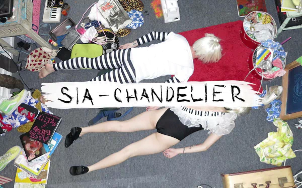 HD PC desktop wallpaper featuring a scene inspired by Sia's music video Chandelier, showing two figures lying on a floor surrounded by scattered items.