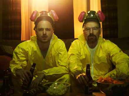 HD desktop wallpaper featuring Aaron Paul as Jesse Pinkman and Bryan Cranston as Walter White in yellow hazmat suits from the TV show Breaking Bad.
