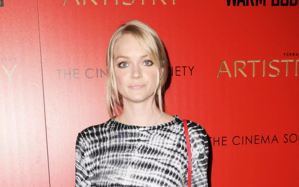 HD desktop wallpaper featuring American model Lindsay Ellingson posing against a red backdrop with event branding.