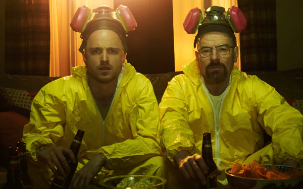 HD desktop wallpaper featuring Aaron Paul as Jesse Pinkman and Bryan Cranston as Walter White in yellow hazmat suits from the TV show Breaking Bad.
