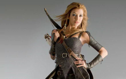 An HD wallpaper featuring India de Beaufort as a warrior in Kröd Mändoon and the Flaming Sword of Fire, showcasing her in armor with a bow and arrows.