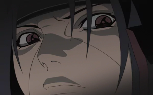 A dramatic close-up of Itachi Uchiha from Naruto, showcasing his intense gaze. This HD wallpaper is inspired by the video game Naruto Shippuden: Ultimate Ninja Storm Revolution.