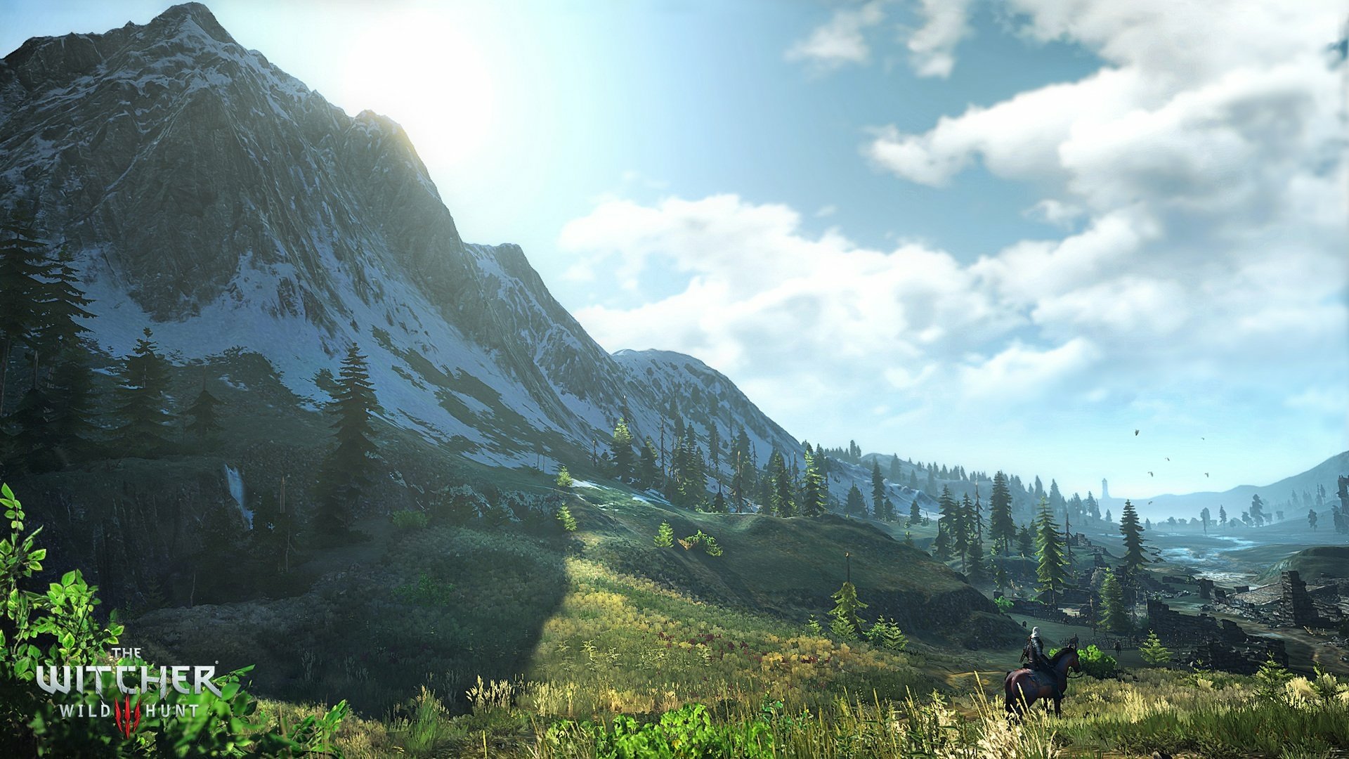 A breathtaking HD wallpaper from The Witcher 3: Wild Hunt, featuring a serene landscape with mountains, lush meadows, and a lone horse under a bright sky.