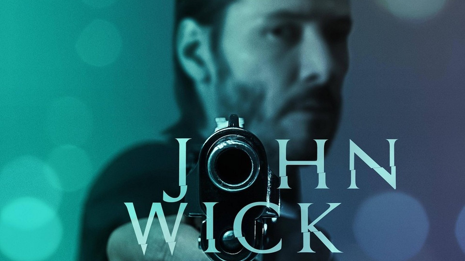 HD PC desktop wallpaper featuring a close-up of John Wick aiming a gun, with a moody blue-green background and the movie title prominently displayed.