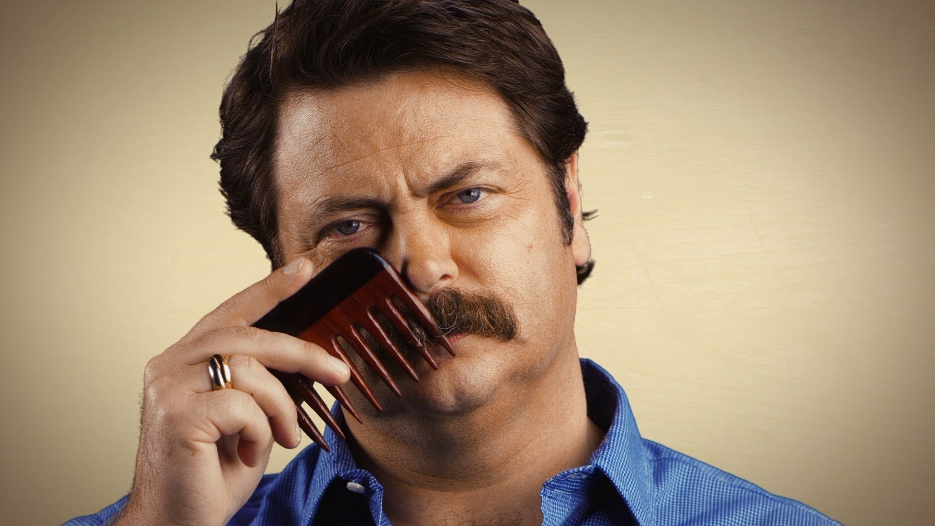 HD desktop wallpaper featuring a man with a mustache combing his mustache, evoking a strong, confident vibe.
