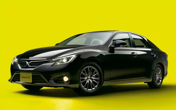 HD PC desktop wallpaper showcasing a sleek black Toyota Mark X vehicle against a bold yellow background.
