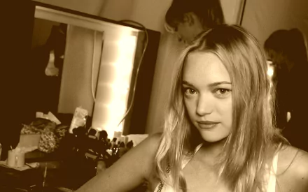 HD desktop wallpaper featuring Australian model and celebrity Gemma Ward in a softly lit dressing room setting.