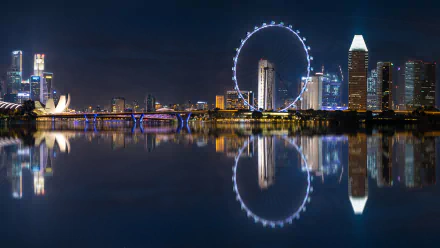 A stunning night view of Singapore featuring the iconic Marina Bay Sands and the Singapore Flyer, reflecting beautifully on the calm waters, making for an impressive HD desktop wallpaper.