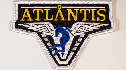 Embroidered ATLANTIS patch with wings and blue Pegasus motif, Stargate Atlantis TV show, 2K Quad HD PC desktop wallpaper and background.