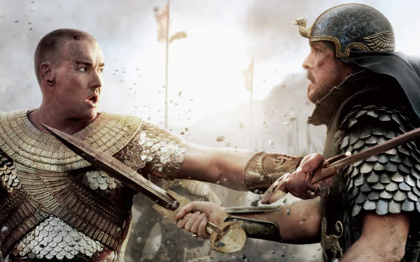 HD PC desktop wallpaper featuring an intense battle scene from the movie Exodus: Gods and Kings, showing two armored warriors clashing swords.