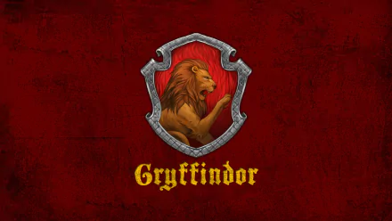 HD desktop wallpaper featuring the Gryffindor emblem from the Harry Potter movies, showcasing a lion on a red and gold shield with Gryffindor written below.