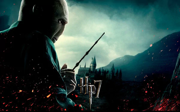 HD desktop wallpaper featuring Lord Voldemort from the movie Harry Potter and the Deathly Hallows: Part 1, set against a dark, fiery background with a castle in the distance.
