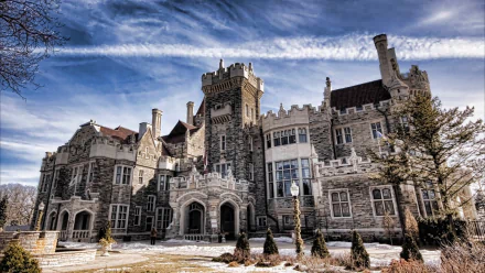HD PC desktop wallpaper and background of Casa Loma, a man-made stone castle with turrets and ornate windows beneath a dramatic blue sky