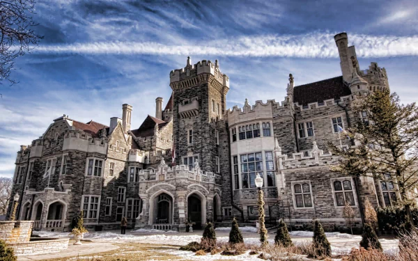 HD PC desktop wallpaper and background of Casa Loma, a man-made stone castle with turrets and ornate windows beneath a dramatic blue sky