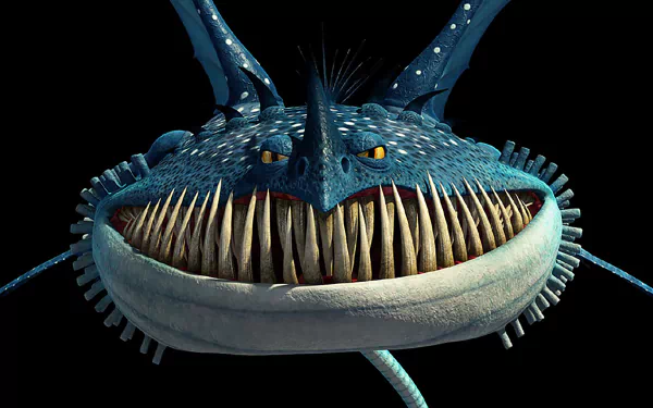 HD PC desktop wallpaper: grinning blue dragon from the movie Book of Dragons, close-up of toothy maw, yellow eyes and spiky fins against a black background.