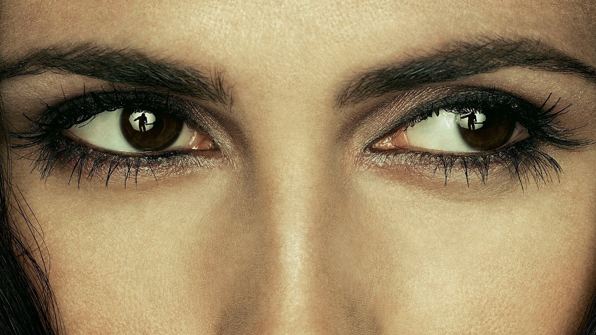 HD PC desktop wallpaper background: close-up of intense female eyes with smoky makeup, music-themed, referencing Within Temptation's gothic rock aesthetic.