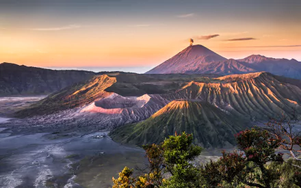 A stunning HD wallpaper of Mount Bromo showcases its majestic volcanic landscape and serene nature, highlighting the rugged terrain and beautiful dawn colors.