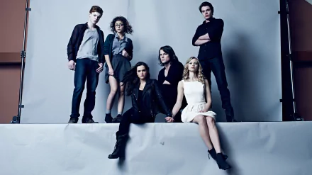Vampire Academy movie promotional shot: six young adults pose on a gray studio backdrop with moody lighting — 5K Ultra HD PC desktop wallpaper and background.