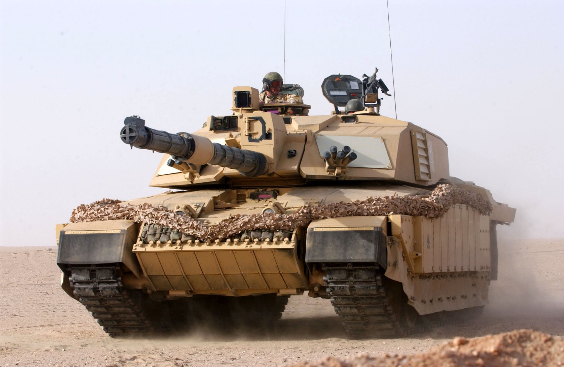 HD wallpaper featuring a formidable Challenger 2 military tank in a desert environment, capturing the robust and powerful essence of this combat vehicle.