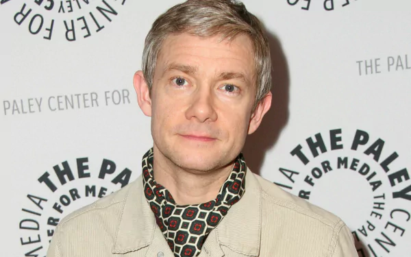 HD desktop wallpaper featuring a portrait of a man against a backdrop with Paley Center logos.