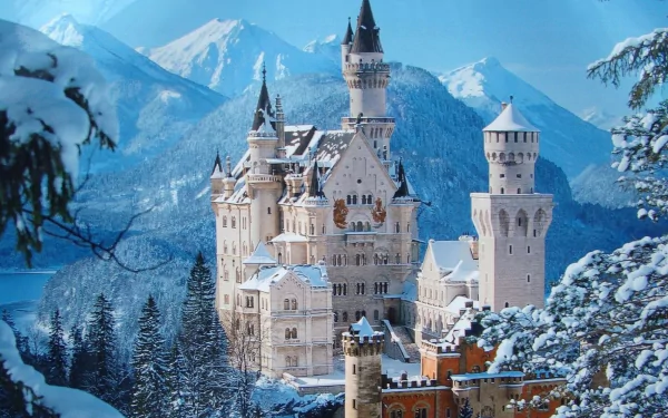 A stunning winter scene of Neuschwanstein Castle in Bavaria, Germany, surrounded by snow-covered mountains and trees, creating a magical, picturesque backdrop.