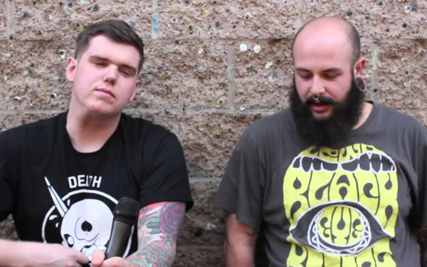 HD desktop wallpaper featuring two members of Being As An Ocean against a textured backdrop.