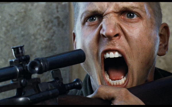 A dramatic scene from Saving Private Ryan, featuring a soldier fiercely shouting while aiming a sniper rifle, captured in high-definition for a striking desktop wallpaper.