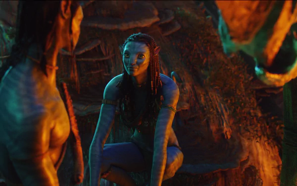 HD PC desktop wallpaper featuring a scene from the movie Avatar, showcasing two Na'vi characters in a dimly lit, natural environment.