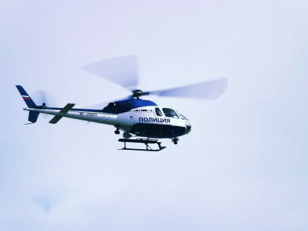 Vehicle: police Eurocopter AS355 Écureuil 2 helicopter in flight against a pale sky — 4K Ultra HD PC desktop wallpaper/background