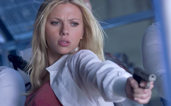 Scarlett Johansson in a gripping scene from the movie The Island, showcasing her fierce determination while aiming a firearm, captured in stunning HD quality.