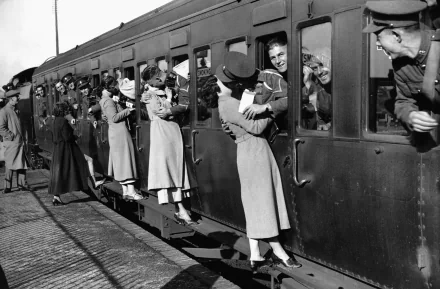 A nostalgic black and white photograph capturing people interacting on a vintage train, showcasing human connection and expression, perfect for a 4K Ultra HD PC desktop wallpaper.