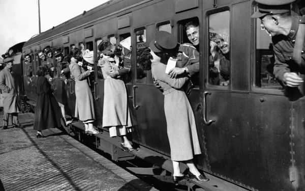 A nostalgic black and white photograph capturing people interacting on a vintage train, showcasing human connection and expression, perfect for a 4K Ultra HD PC desktop wallpaper.