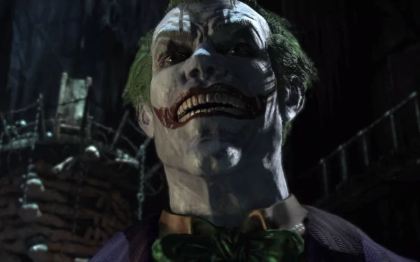 HD PC desktop wallpaper of the Joker from the Batman: Arkham Asylum video game — close-up grin, pale face, smeared red smile and green hair in a dark asylum.
