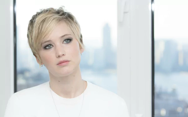 4K Ultra HD PC desktop wallpaper featuring a close-up of celebrity Jennifer Lawrence with short blonde hair and a soft, neutral expression.