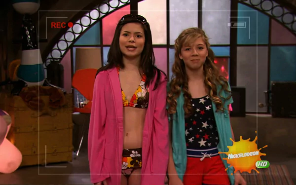 HD PC desktop wallpaper featuring Carly and Sam from the TV show iCarly (2007) standing together in a colorful studio setting.