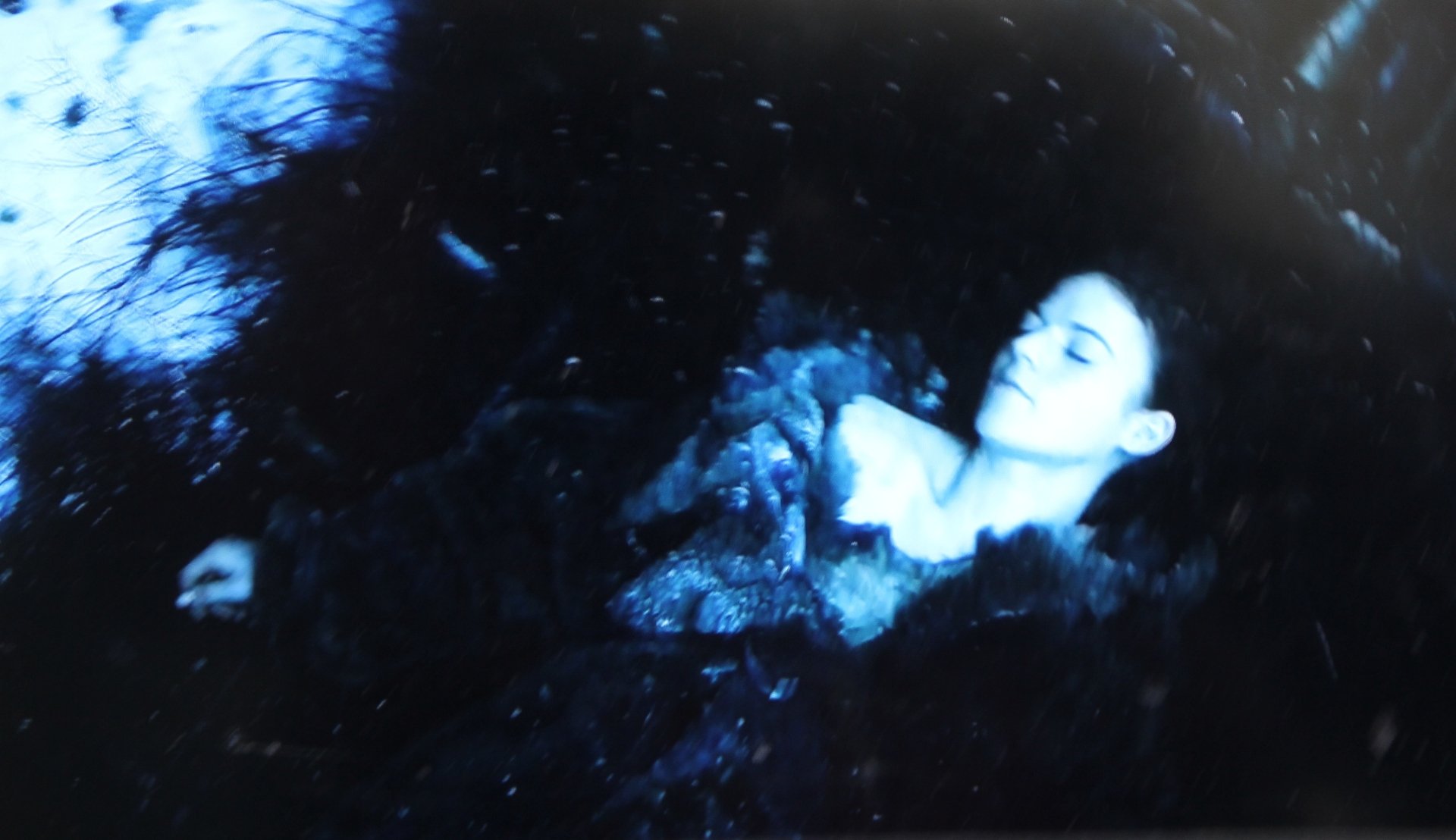 HD desktop wallpaper featuring Rose Leslie as Ygritte from the TV show Game of Thrones, surrounded by a dark, icy blue atmosphere.