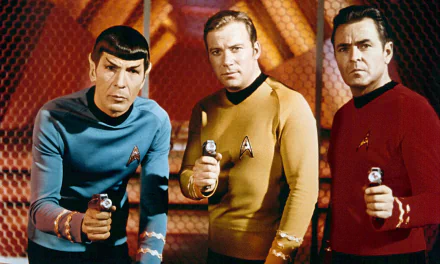 HD PC desktop wallpaper of three Starfleet officers from the TV show Star Trek: The Original Series aiming phasers on the ship's bridge.