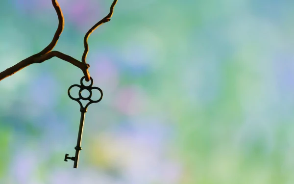 A man-made key hangs delicately from a natural branch against a soft, blurred background, creating an HD PC desktop wallpaper and background.