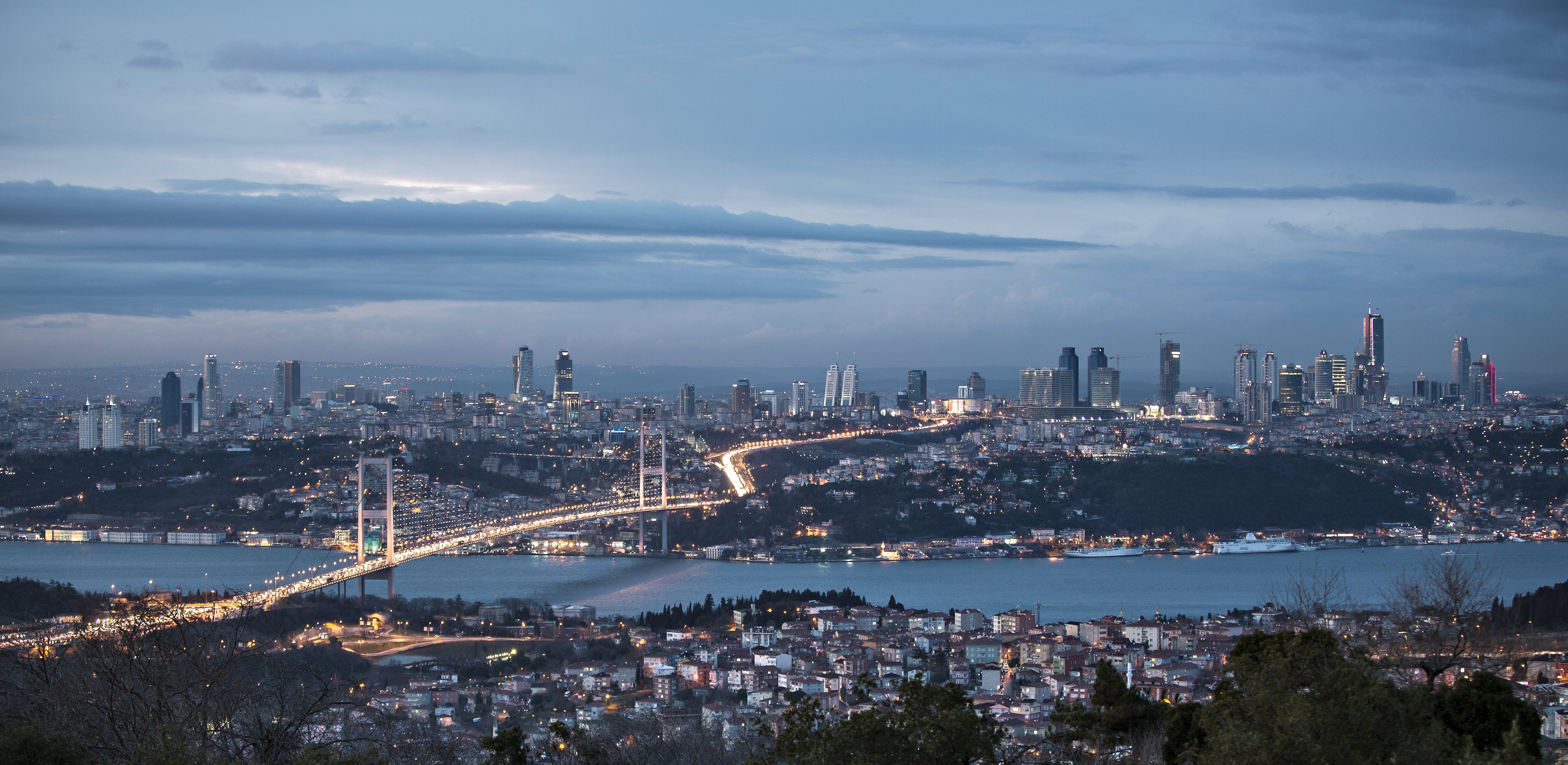 Bosphorus and bridge at night by ihsan Gercelman