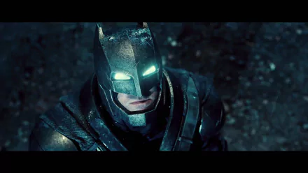 HD desktop wallpaper featuring Batman in Batman V Superman: Dawn of Justice, with glowing white eyes, set against a dark, rainy background.