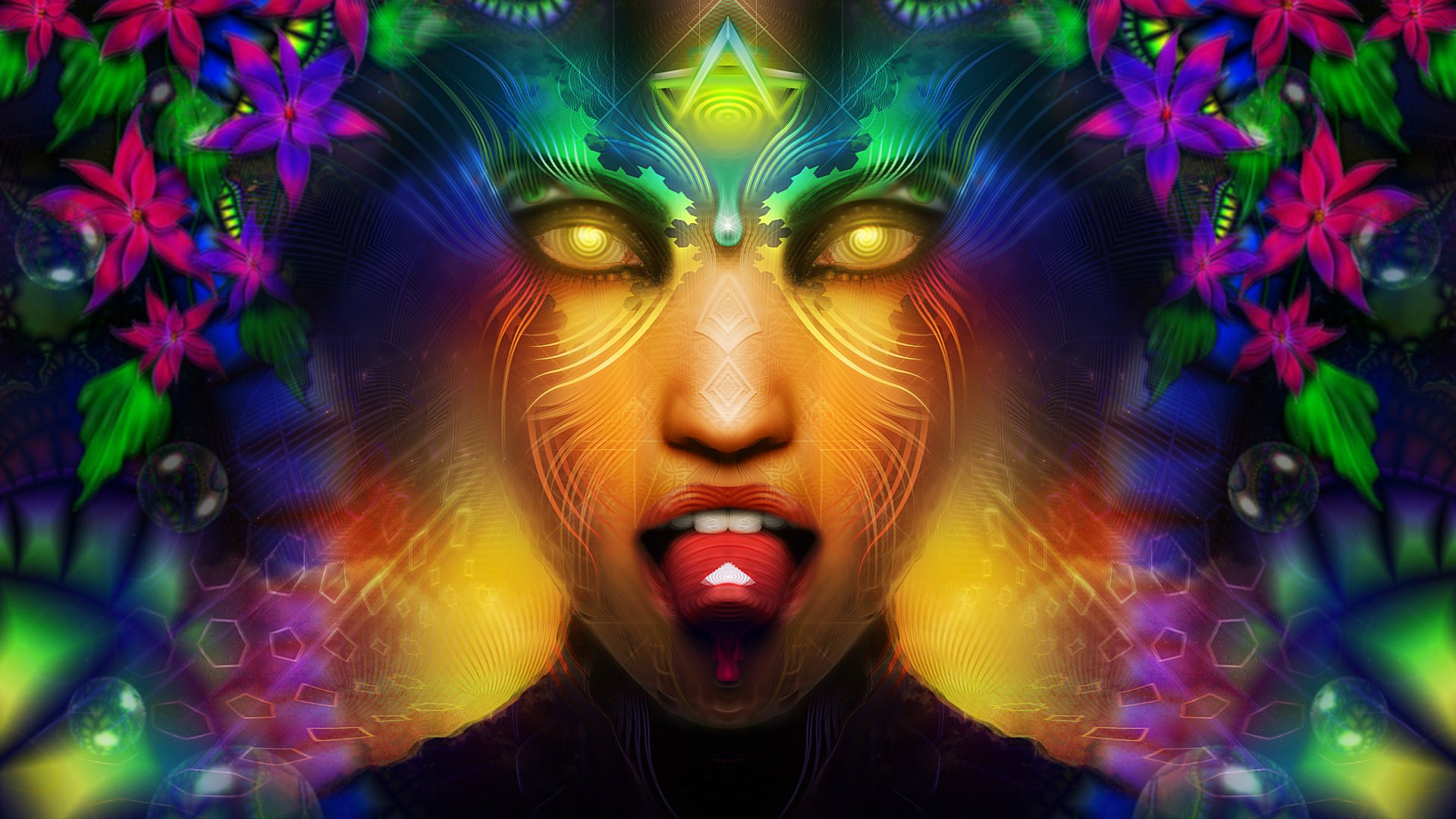 Religious, artistic HD PC desktop wallpaper: neon deity face with glowing golden eyes, ornate facial markings and a protruding tongue, surrounded by vivid flowers and mirrored psychedelic patterns.