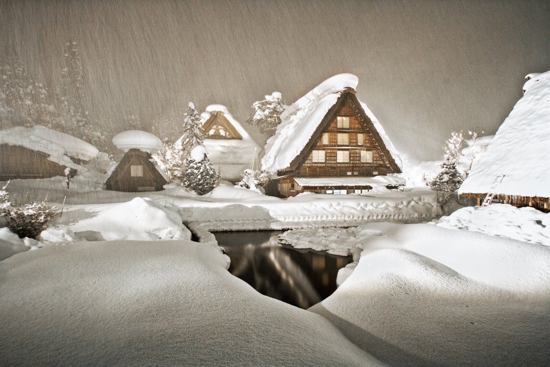 Snow-covered traditional houses in Shirakawa village, Gifu Prefecture, Japan, during a winter snowfall, captured in stunning 4K Ultra HD quality.